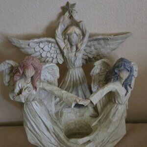 A Carved Resin Sculpter of 3 Angels decorative plaque for wall.